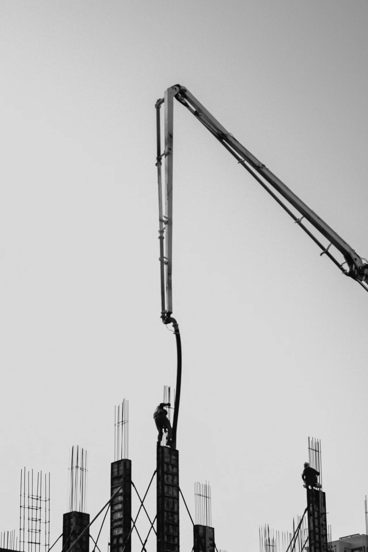truck-mounted boom pump placing concrete at a Portland site