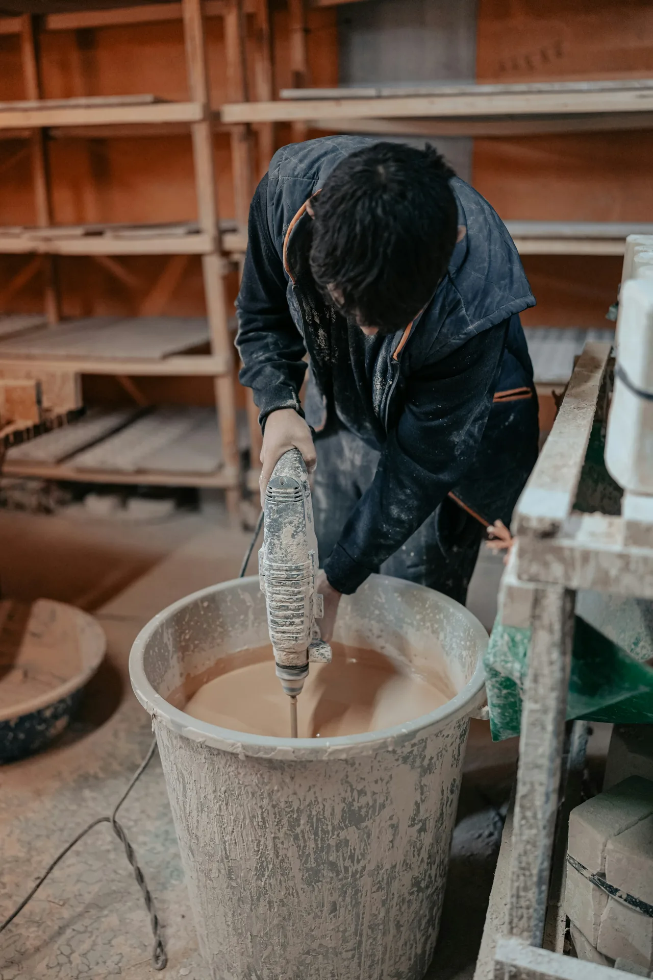 Quikrete bagged concrete being mixed in a paddle mixer on a Portland site