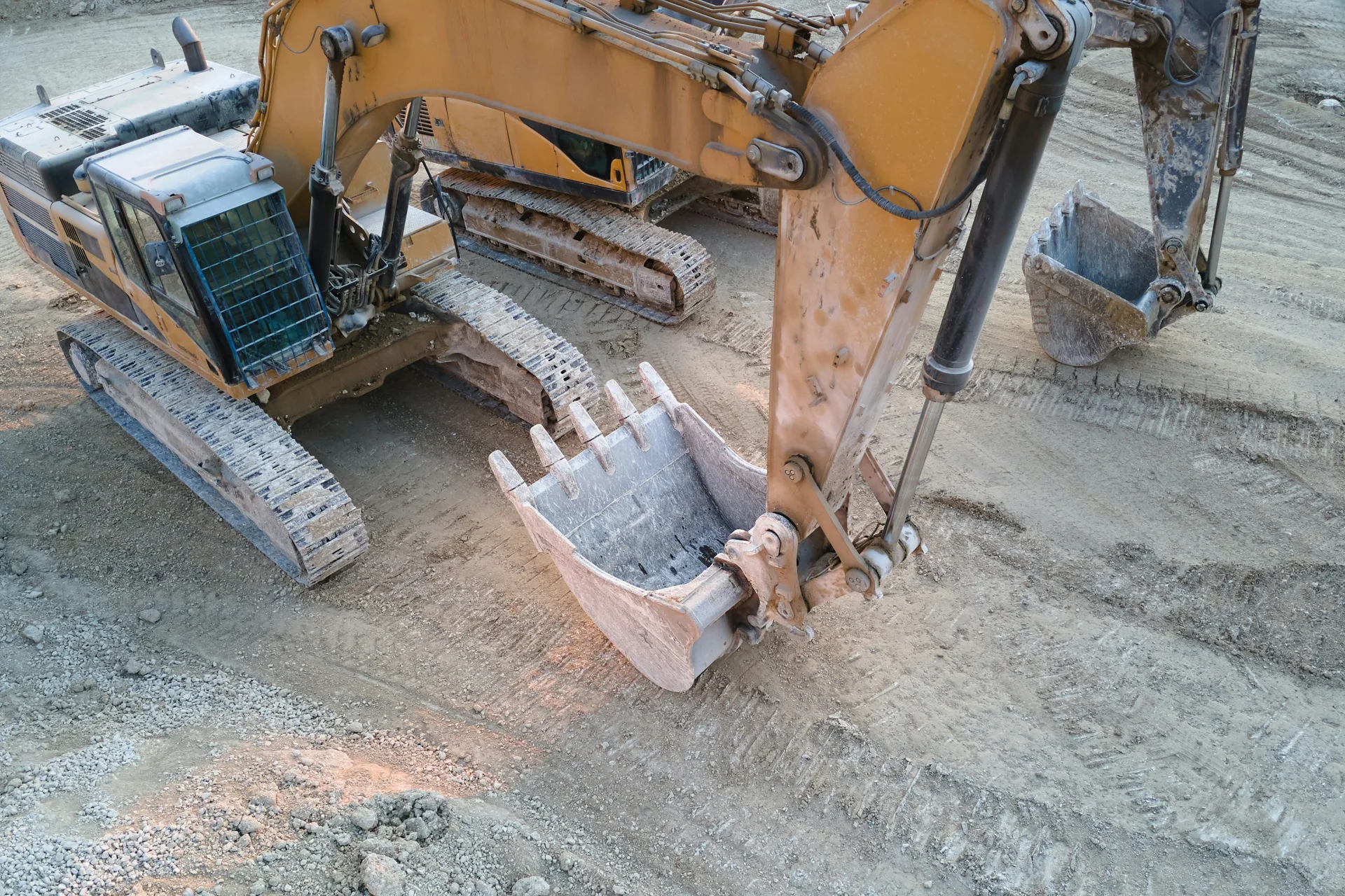excavator working on a heavy-equipment concrete pad in Portland