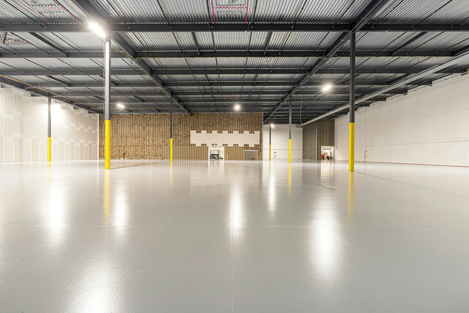 cold-storage warehouse floor with column protectors in Portland