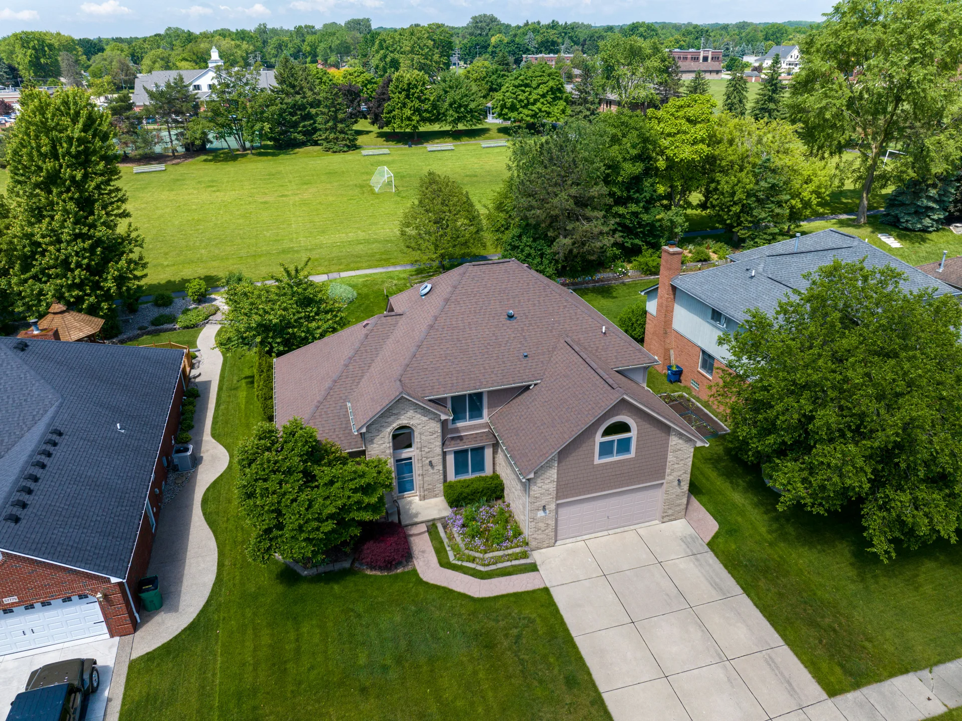 aerial view of brushed-finish concrete driveways in a Portland suburb