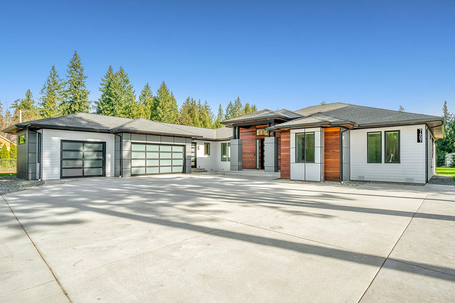 well-maintained sealed concrete driveway at a modern Portland home