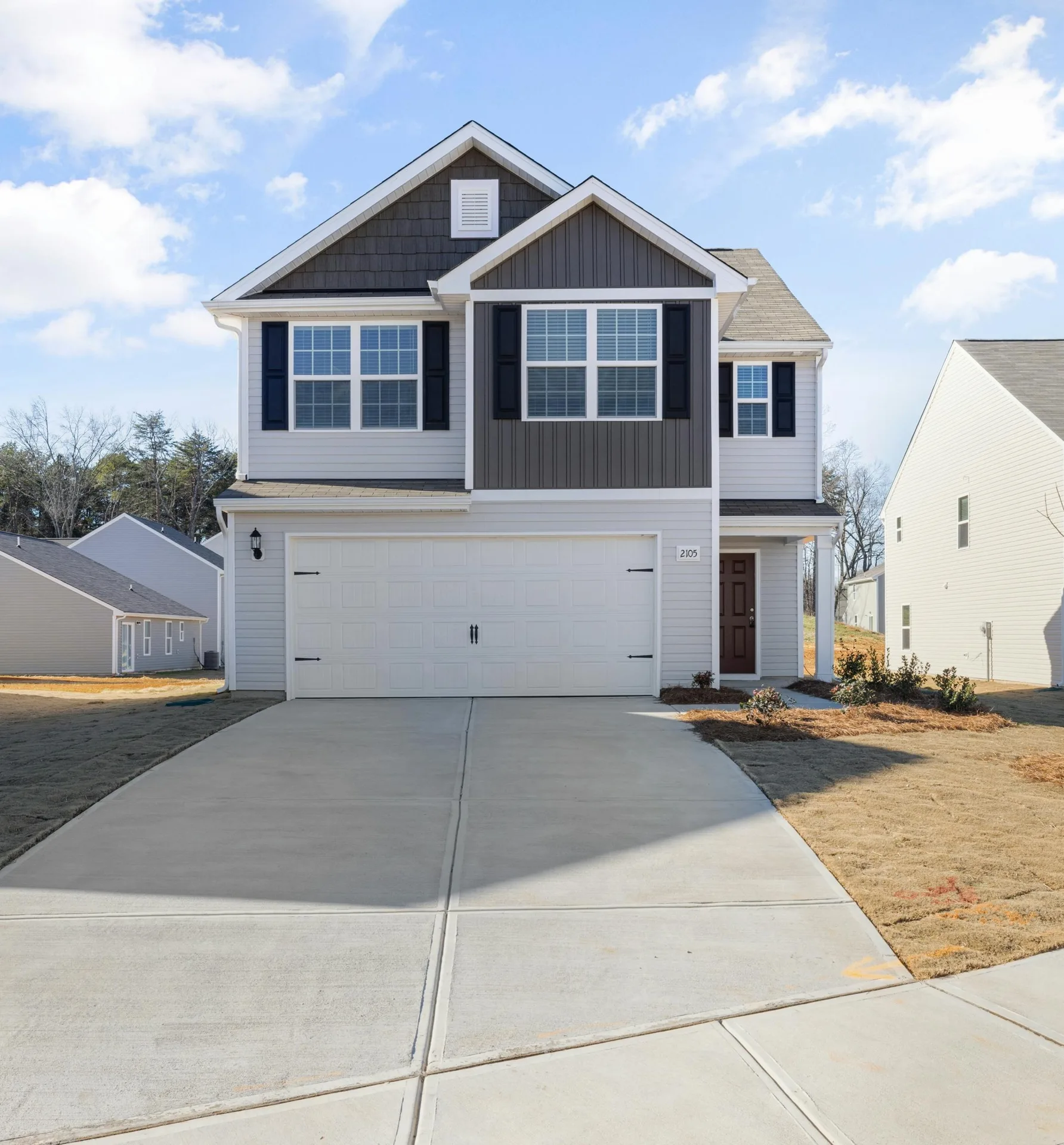 concrete driveway at a new-build grey home in Gresham