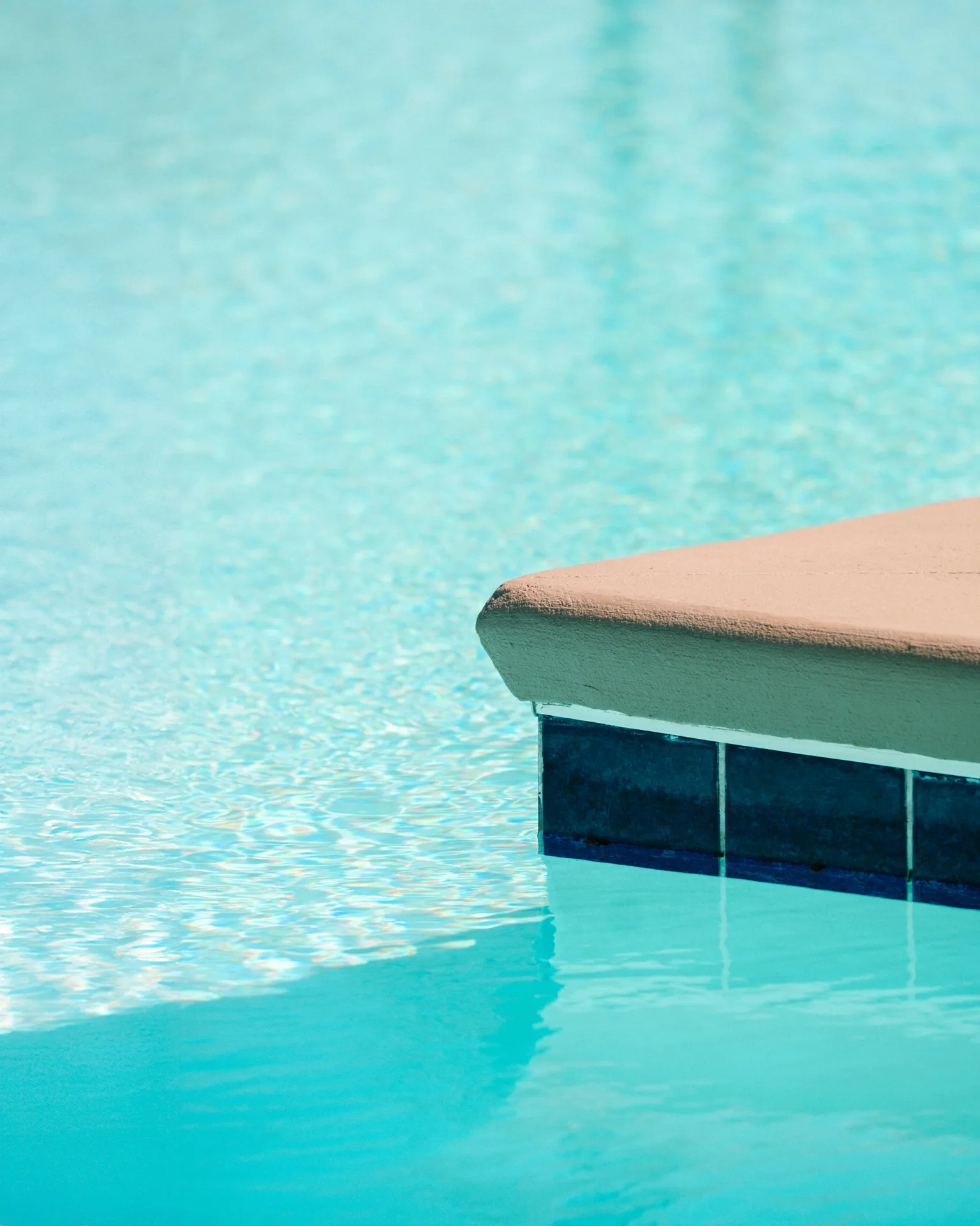 concrete pool step with tile in a Portland pool