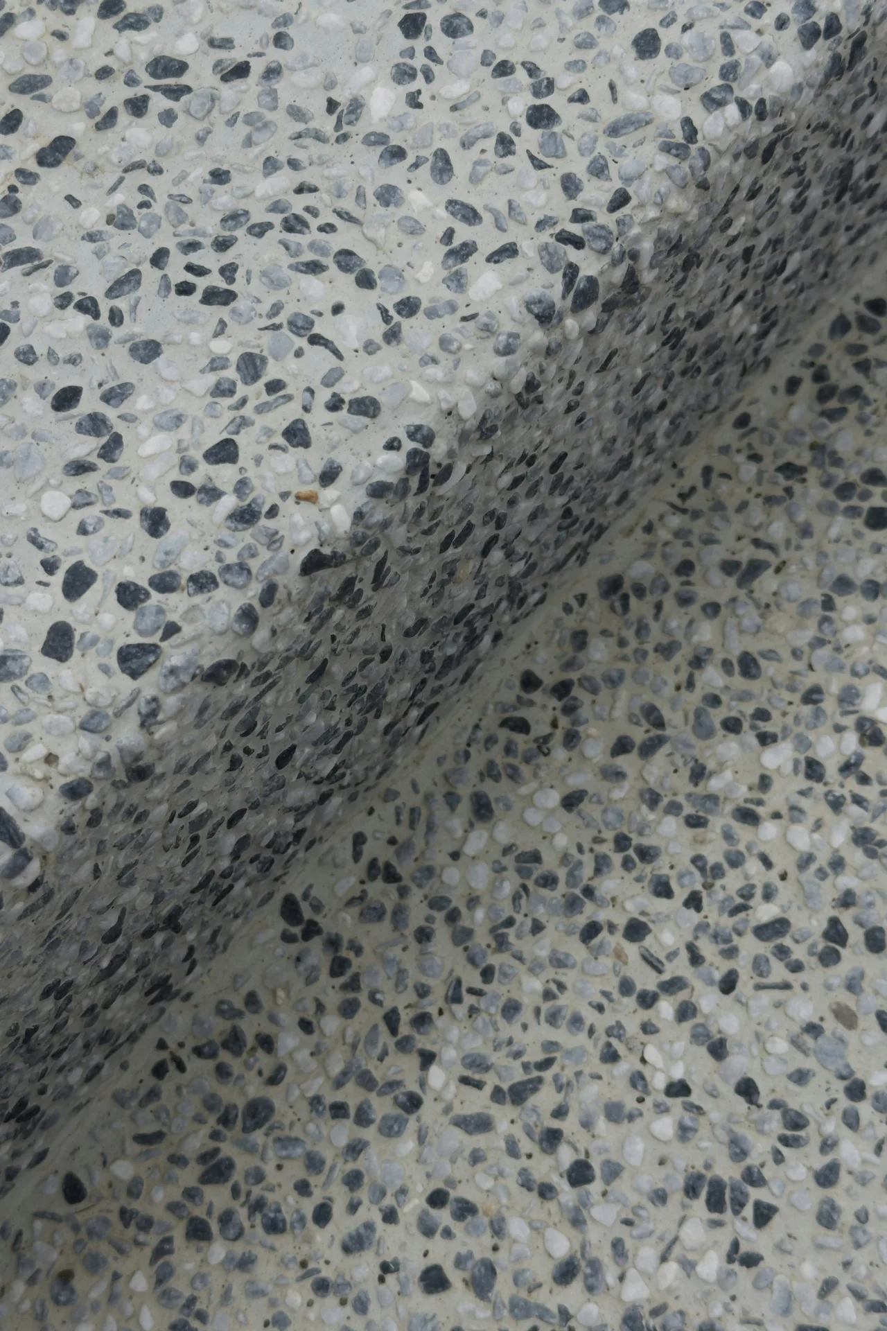 exposed-aggregate concrete texture close-up in Portland