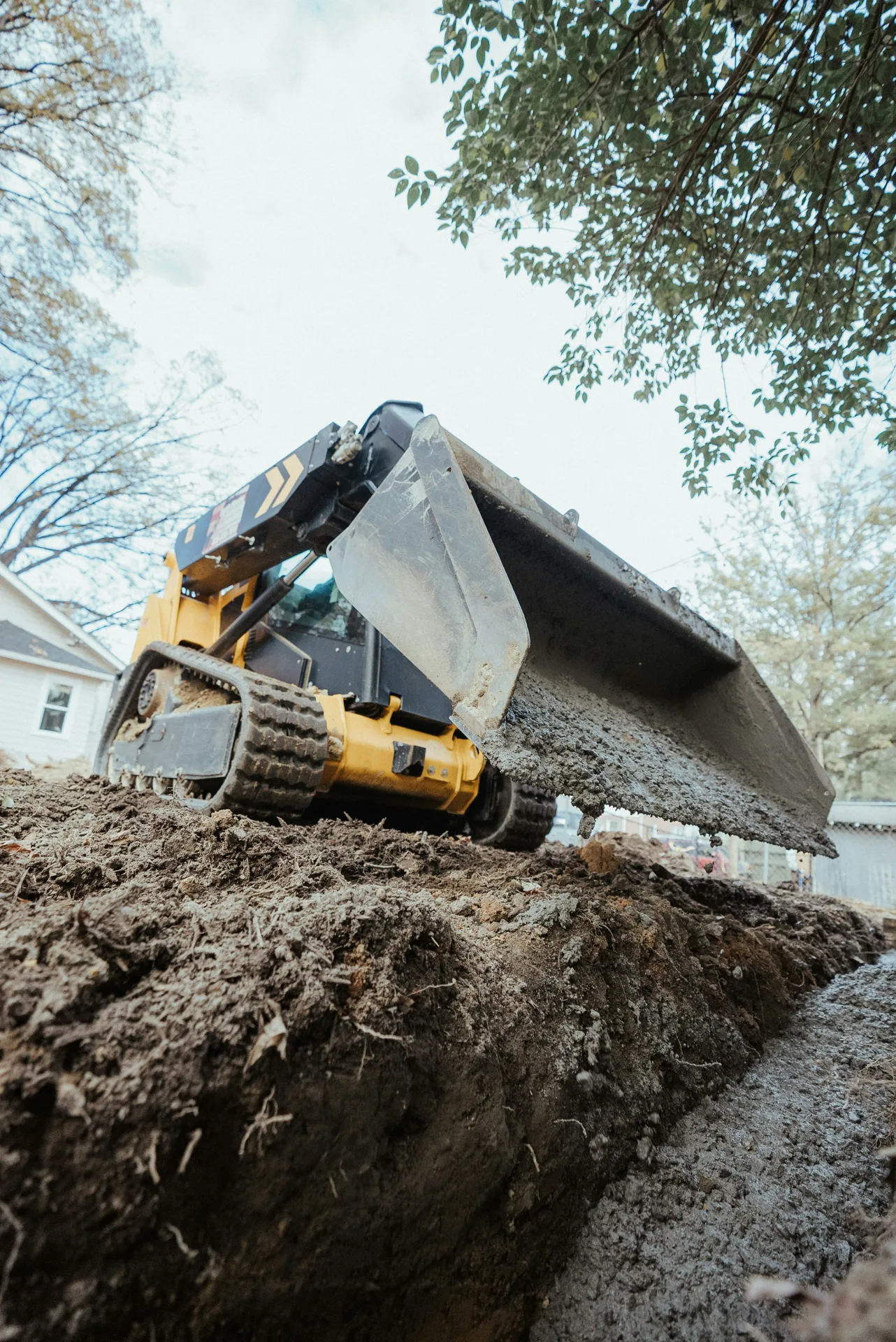 foundation repair pour with a track loader in Portland