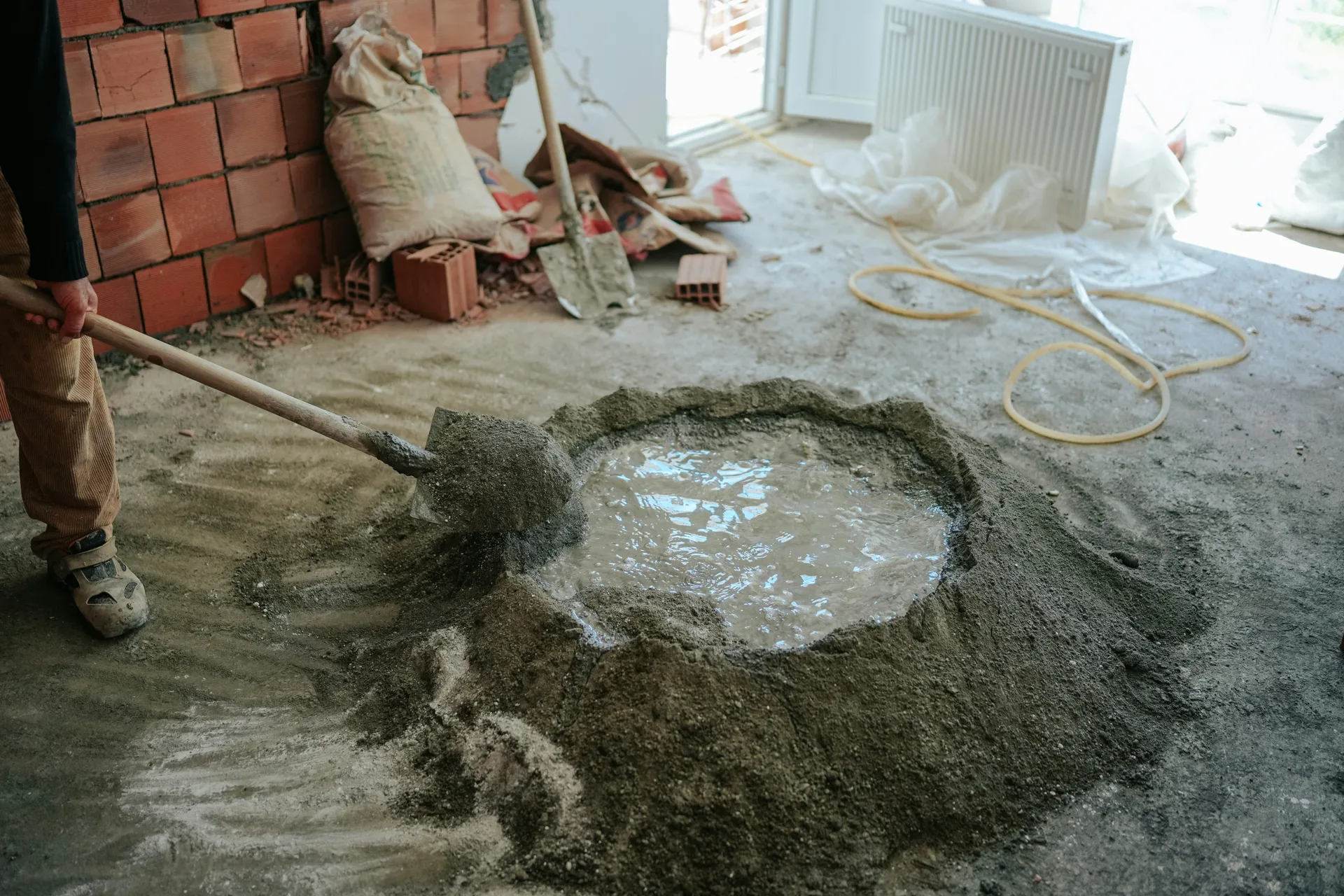 Quikrete mortar being hand-mixed on a Portland renovation