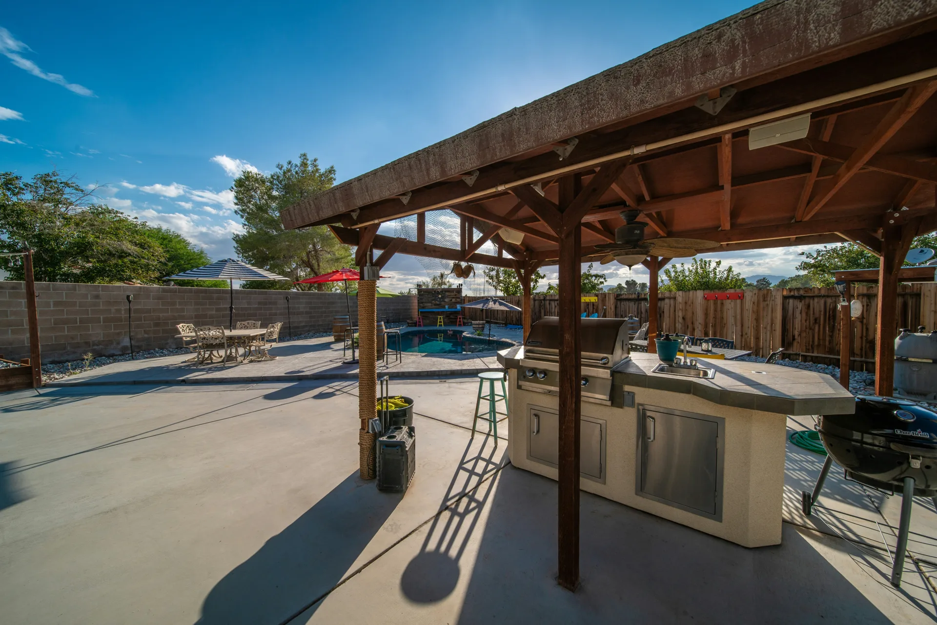 broom-finish concrete pad around a fire pit at a Portland home
